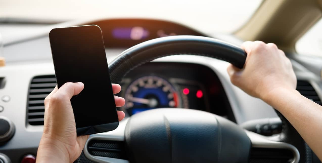 This driver holding a cell phone should know what we can learn from AAA’s distracted driving road test?